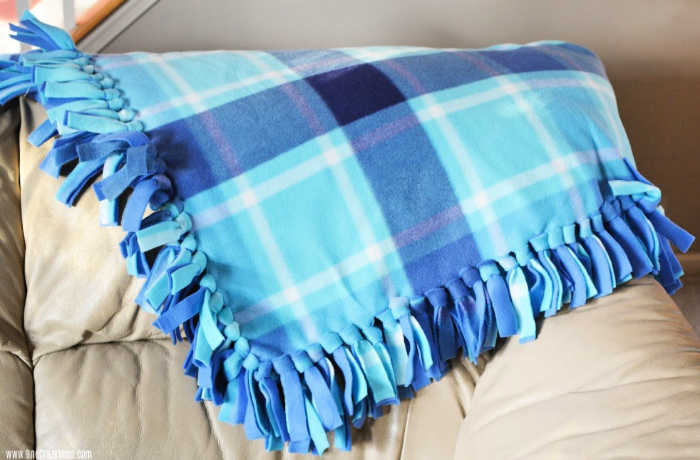 Blanket ready to use and on a chair.