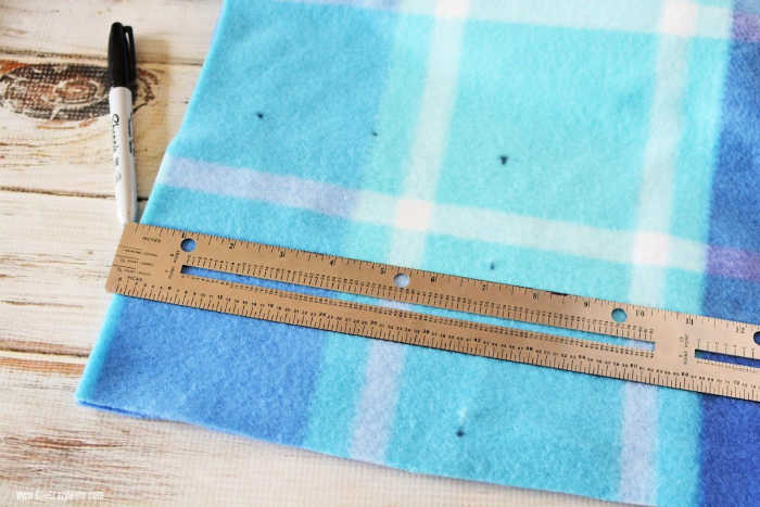 Blanket being measured.