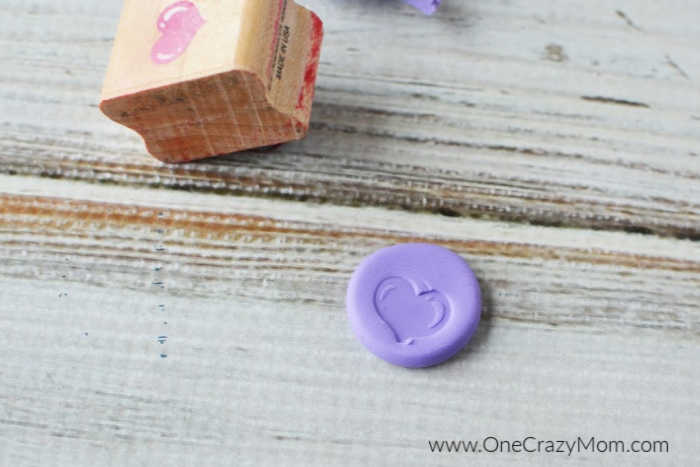 Stamp placed on clay.