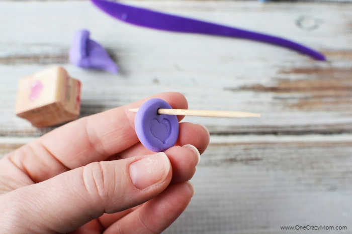 Toothpick inserted into clay.