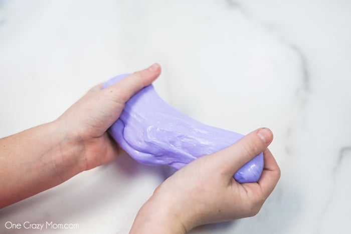 Slime being pulled between hands.