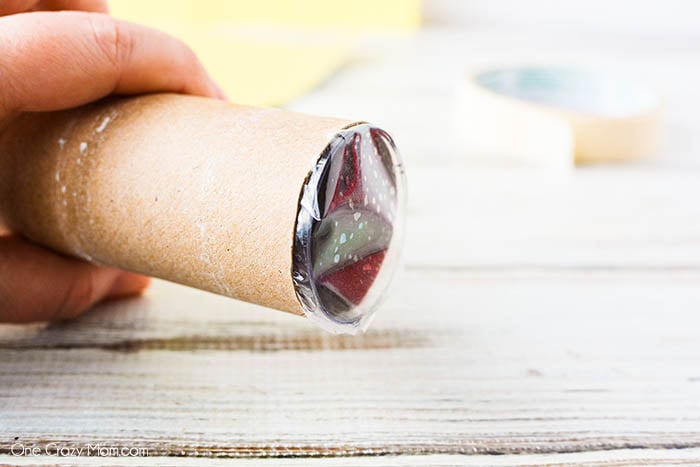 Beads inserted into cardboard roll.