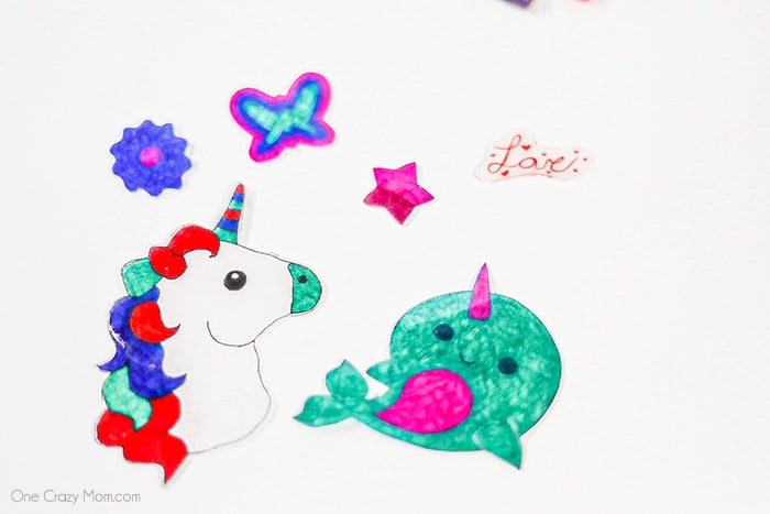 Shrinky Dinks on baking sheet cooling.