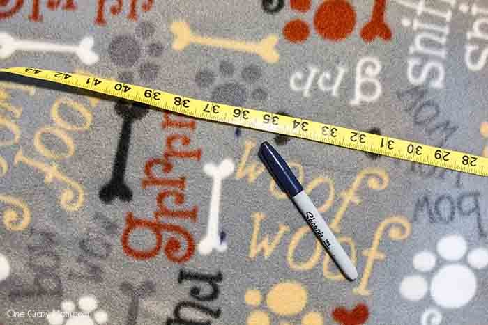 Fabric being measured and marked.