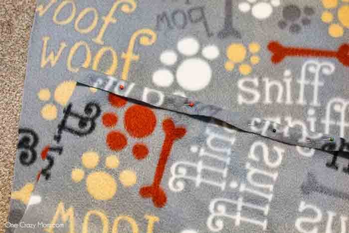 Pin the fabric at the edge.