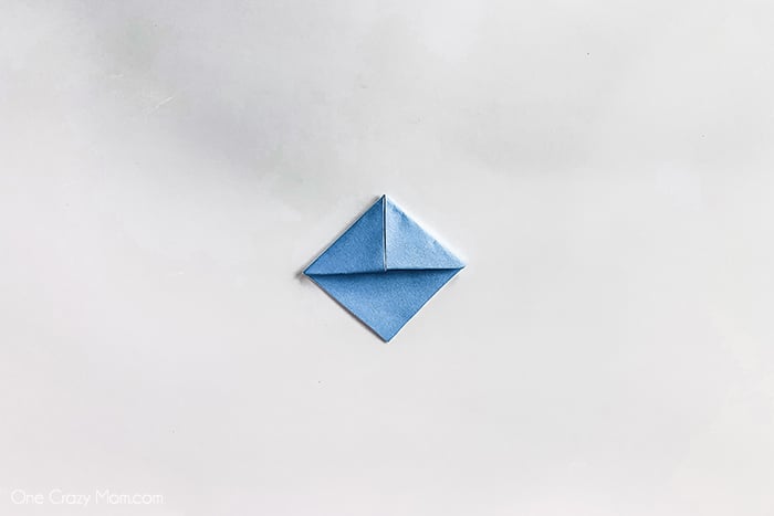 Paper folded into triangle.