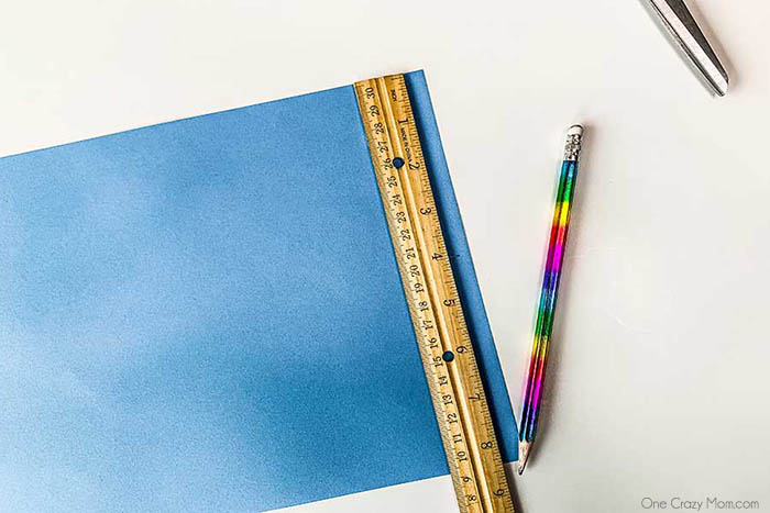Paper with ruler and pencil.