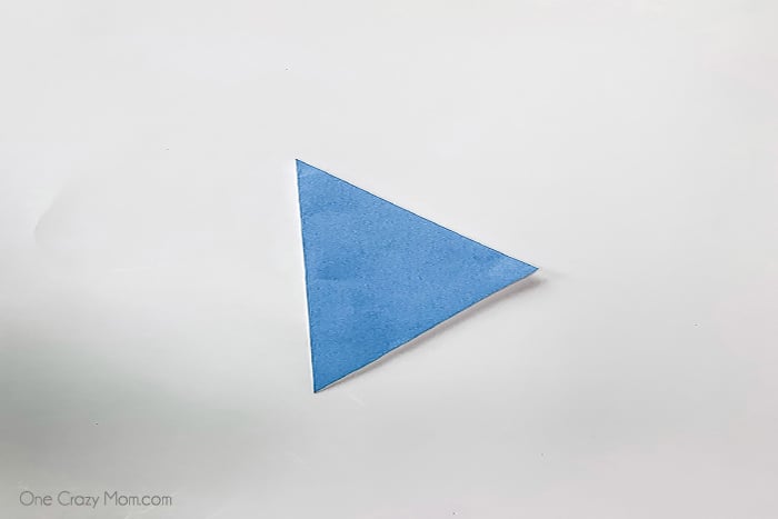 Paper folded into triangle.