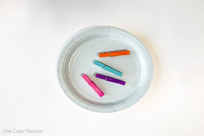 Clothes pins painted different colors.