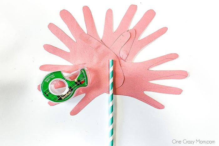 Straw glued on the back of hands.