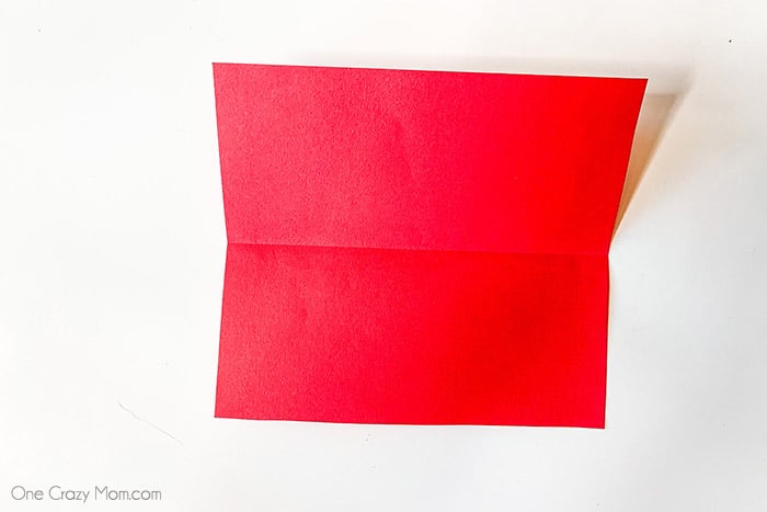 Red piece of paper folded in half.