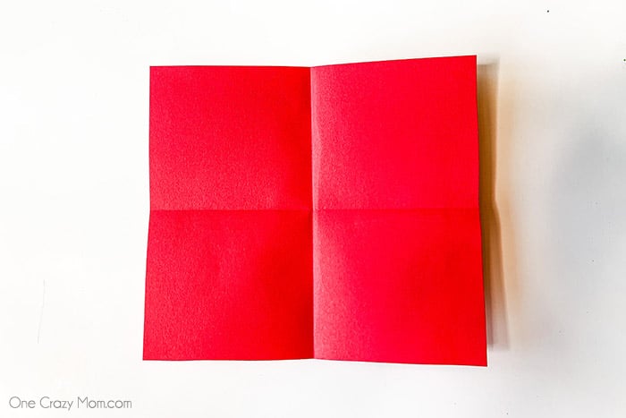 Red paper folded into squares.