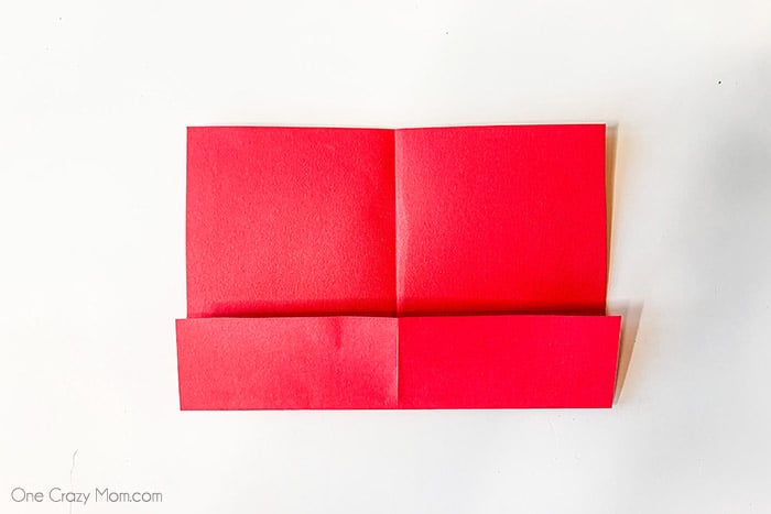 Red paper folded at the bottom.