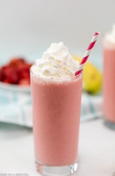 Smoothie in cup with straw.