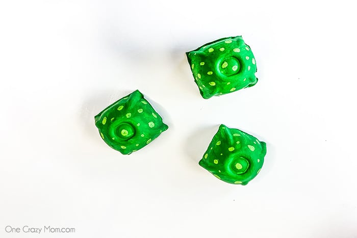 Egg carton painted with spots.