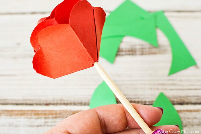 Wood skewer attached to rose.