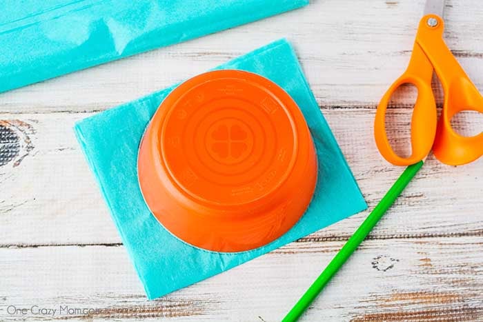 Tissue paper being traced with bowl.