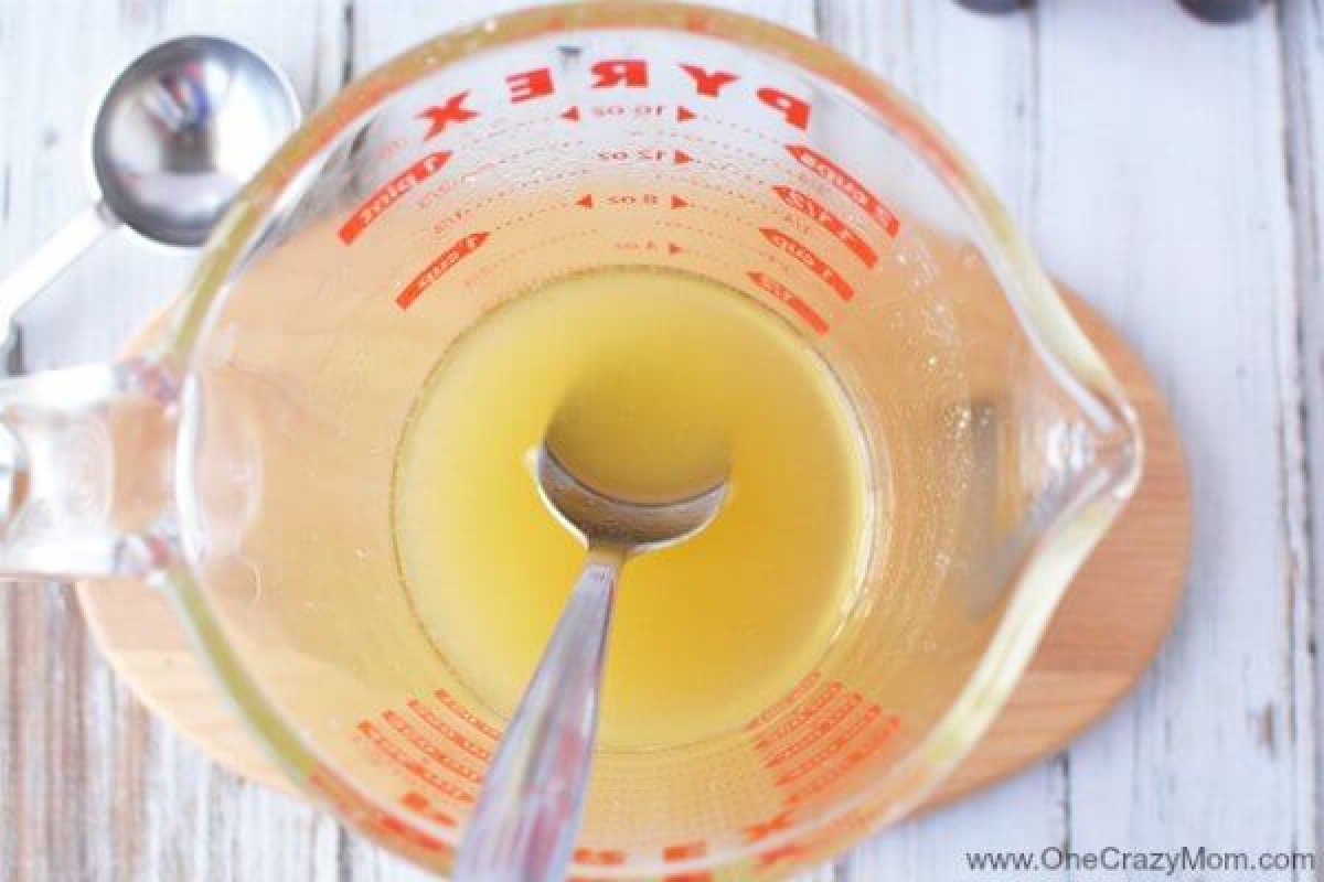 Shea butter and coconut oil melted in a container.