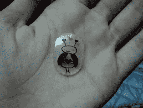 Shrinky Dink in hand.