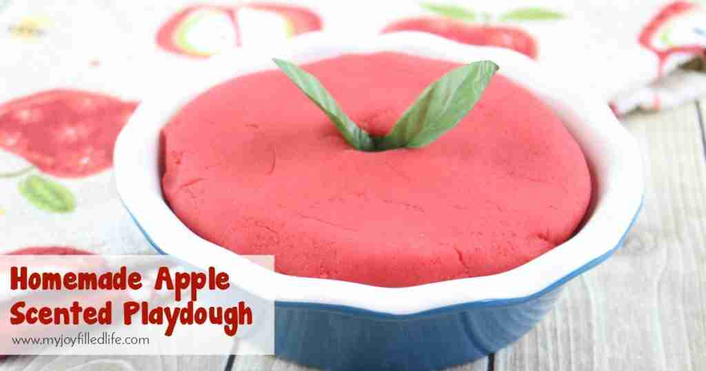 Apple scented playdough in container.