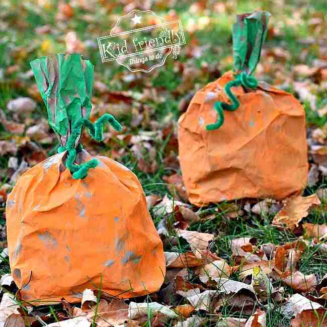 Paper bag painted orange to look like a pumpkin.