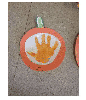 Pumpkin made out of handprint.