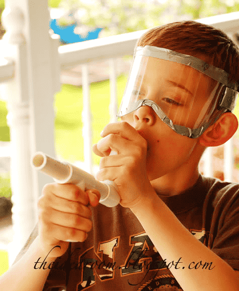 Child with marshmallow gun.