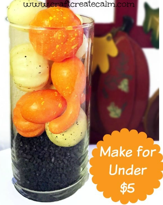 Container with pumpkins and gourds.