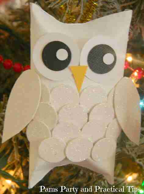 Snow Owl ornament in tree.
