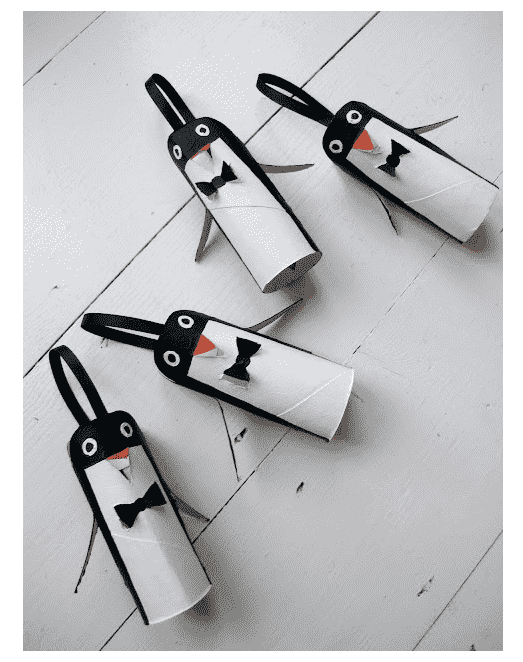 Penguins laying on table.