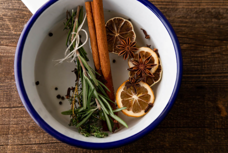 Simmer pot with herb and spices in water.