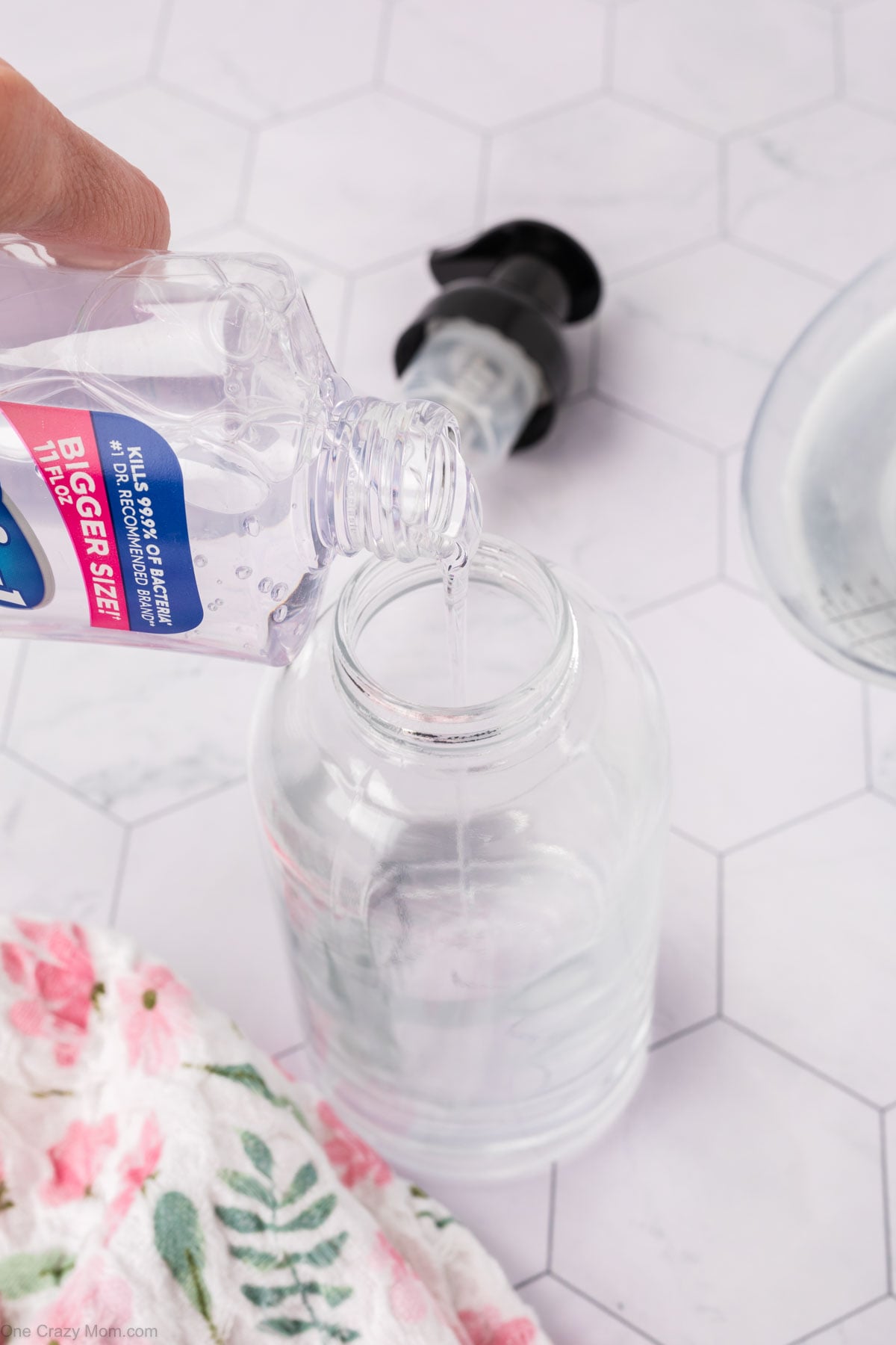Soap being poured into bottle.