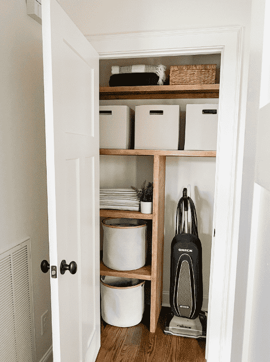 Wooden shelves in closet.