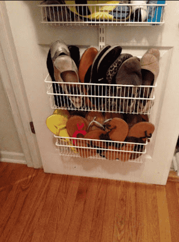 Wire baskets for shoes on door.