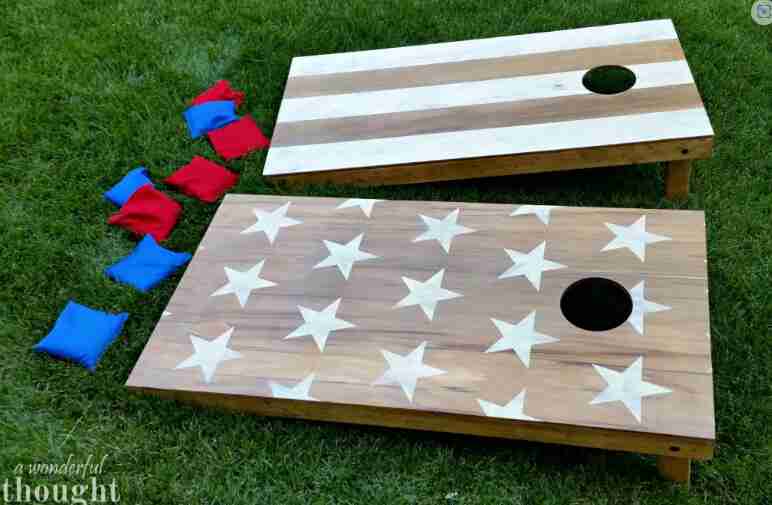 Corn hole boards in the grass.