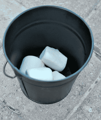 Bucket with marshmallows inside.