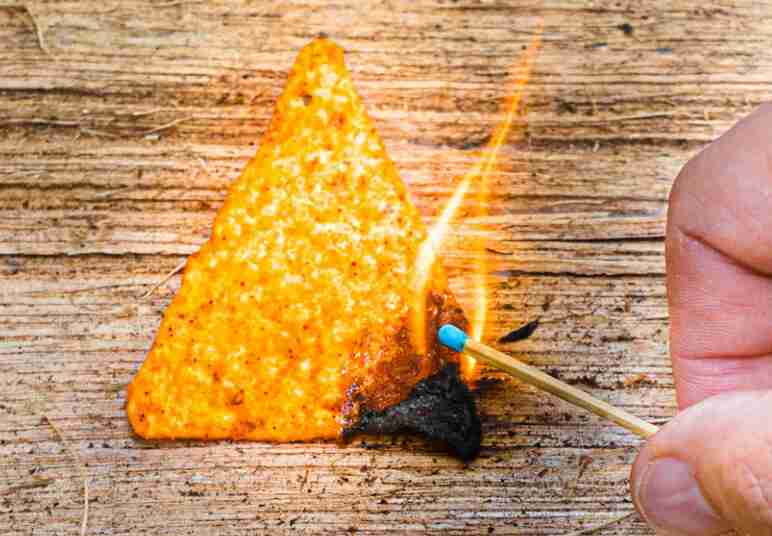 Doritos and match being lit.