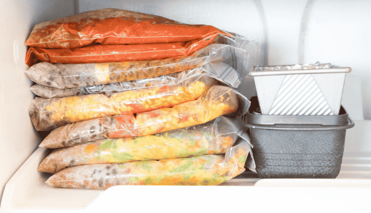 Ziplock bags stacked in the freezer.