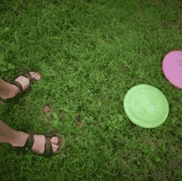 Frisbee golf in the field.