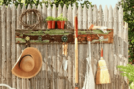 Garden tool rack with spigots.