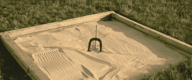 Horseshoe pit ready to play.