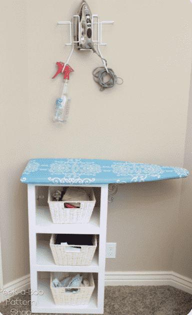 Cubbies with ironing board.