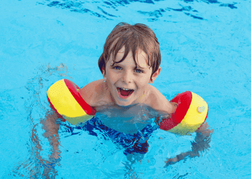 Child swimming in the pool.