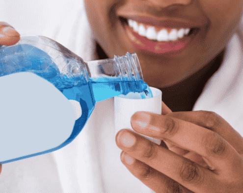 Mouthwash being poured.