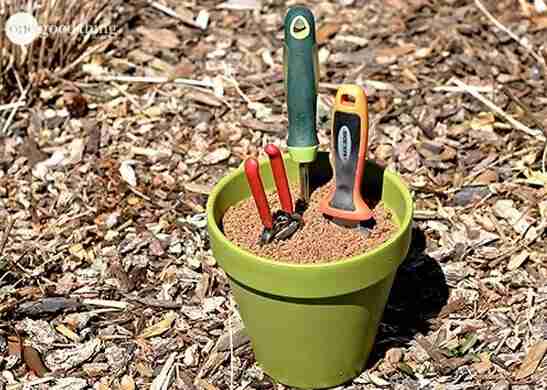 Garden tool holder with tools.