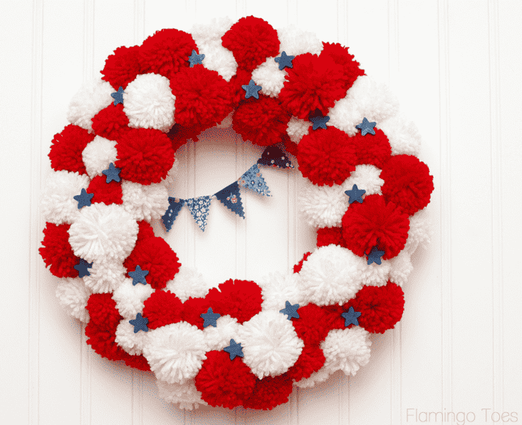 Pom Pom wreath on wall.