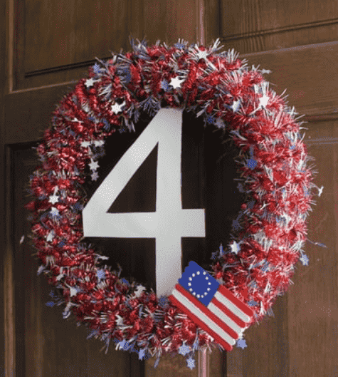 Wreath made out of a pool noodle and tinsel.