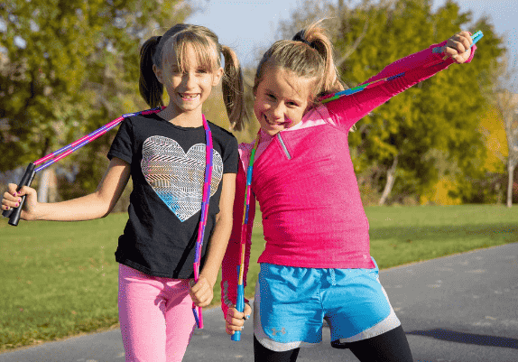 Girls playing jump rope.