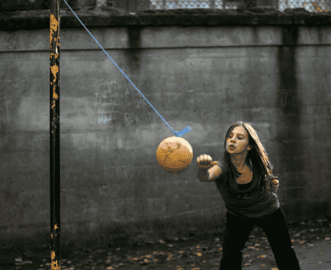 Tetherball and a child.