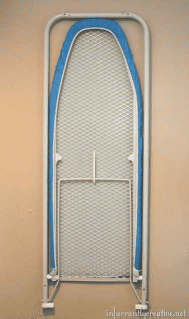 Ironing board mounted on wall.